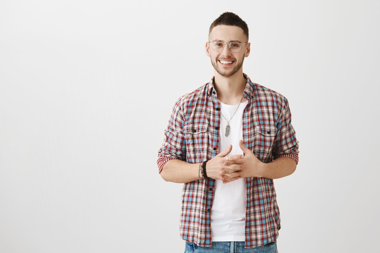 carlos smiling for the camera, he looks a little nervous