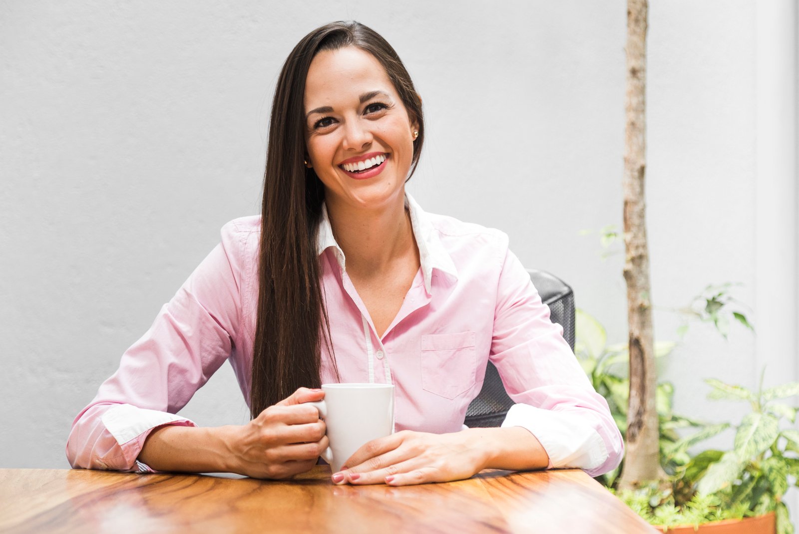 smiling maria drinking a cup of coffe